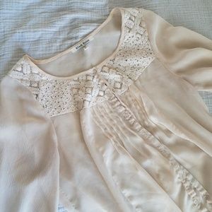 Cream-colored lace top.